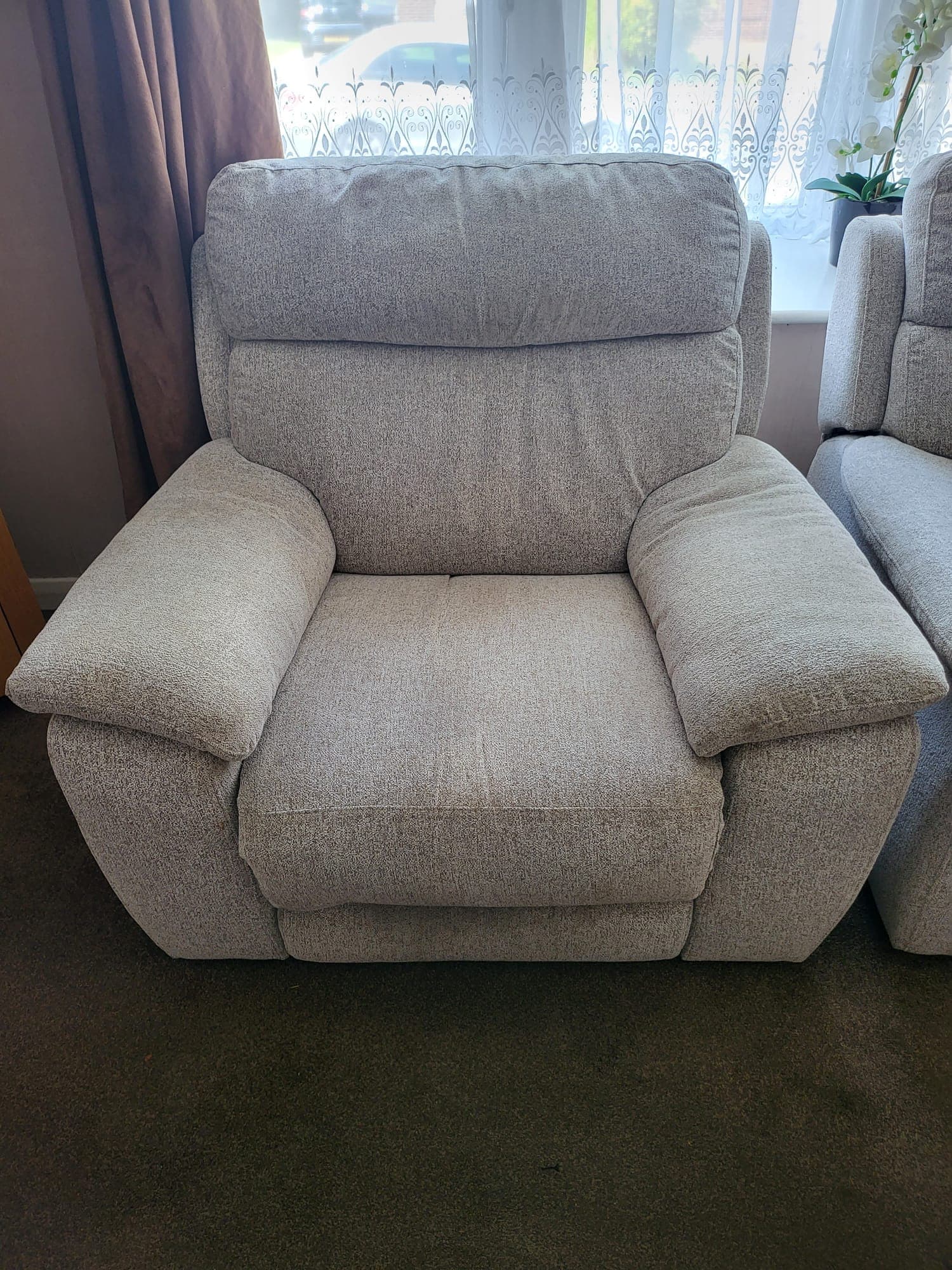 Light-fabric armchair before professional upholstery cleaning
