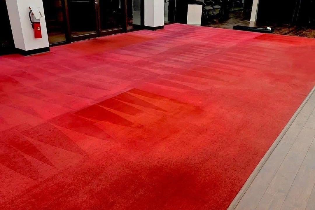 Red carpet after professional carpet re-dyeing