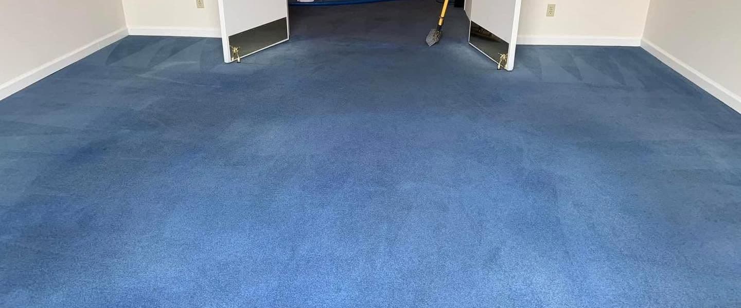Blue carpet before professional carpet re-dyeing