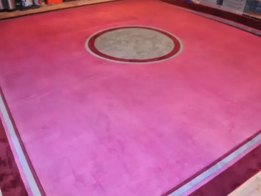 Patterned rug after professional colour restoration across its central field