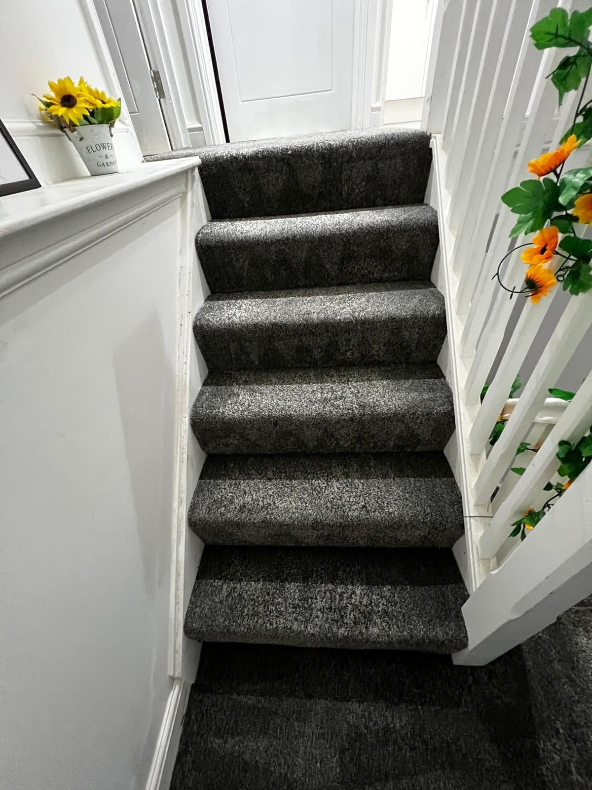 Dark staircase carpet after George completed a professional deep clean