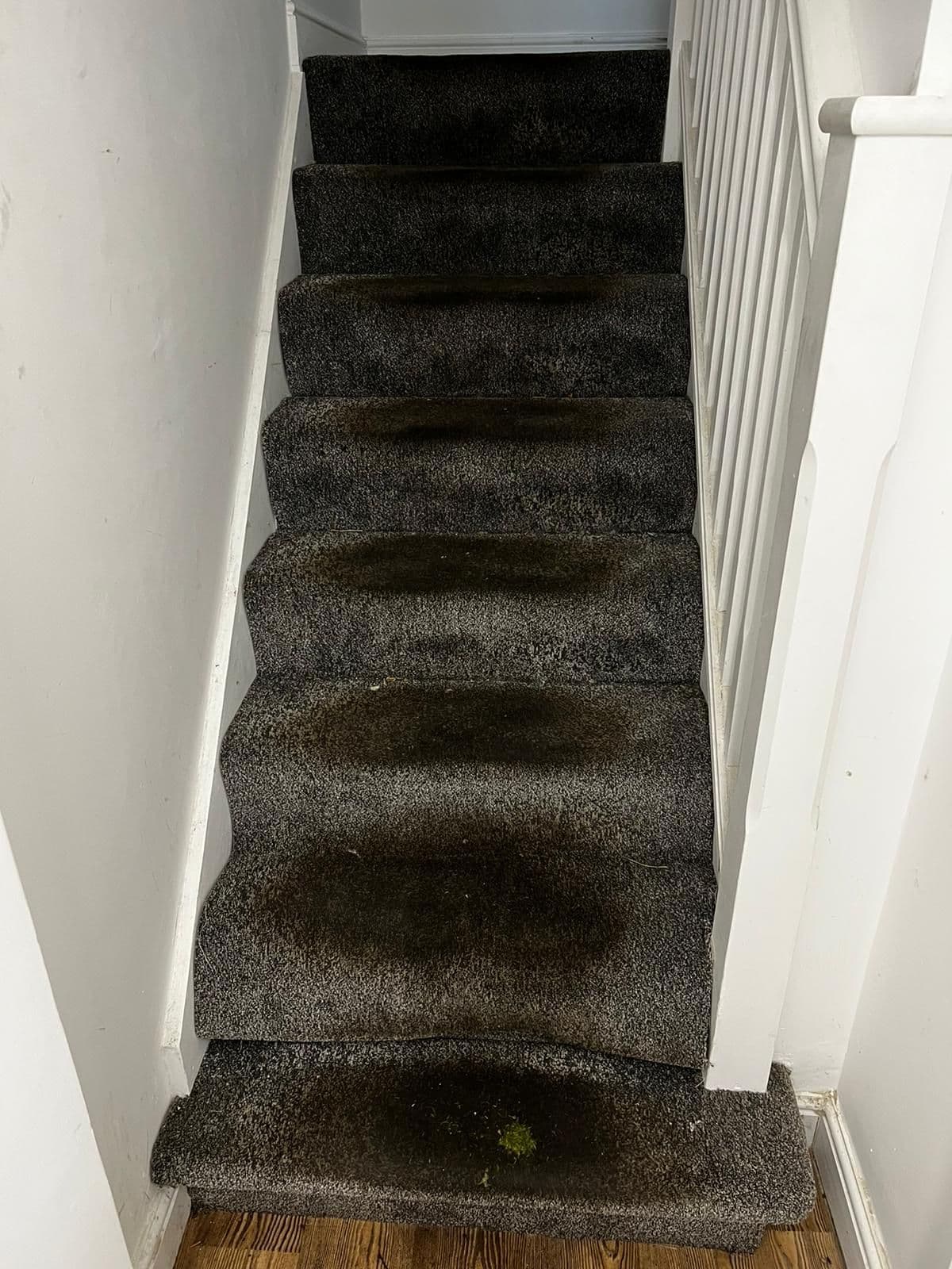 Manufacturing-site staircase with heavy ingrained soiling before professional cleaning