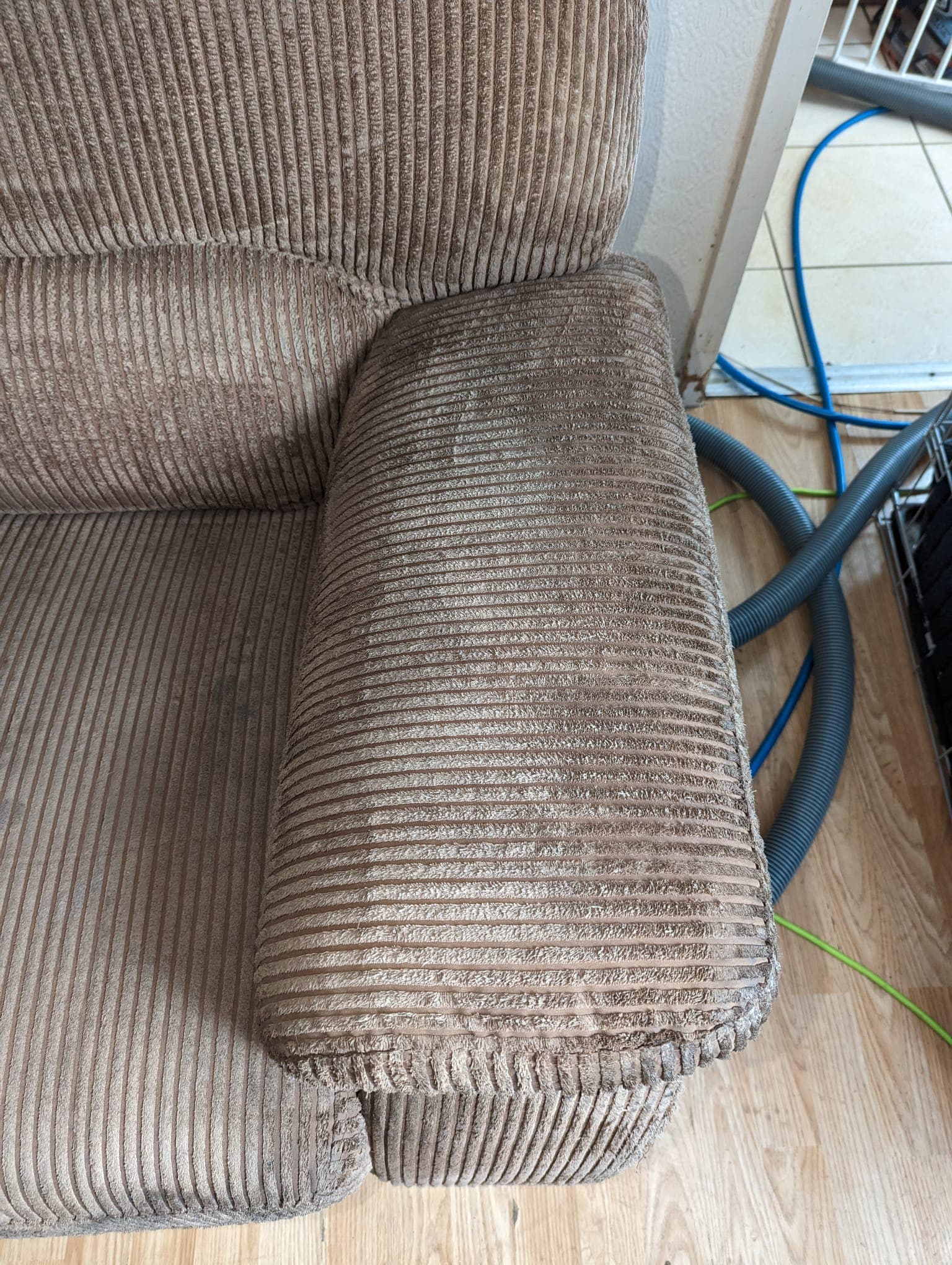 Cord-upholstered sofa arm after George completed professional upholstery cleaning